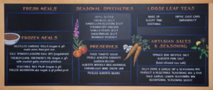 chalkboard sign with art and menu text